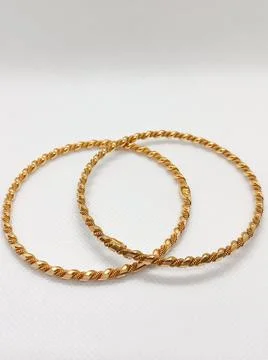 Beautiful Gold Bangle isolated White Background Stock Photos