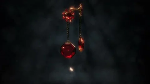 Beautiful gold eardrops with red ruby gem gemstones rotate, fictitious Stock Footage 194990939