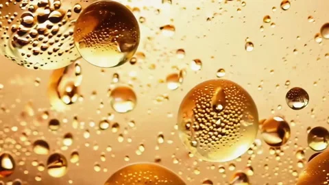 The Beautiful Golden Bubbles Floating in Liquid Fluidity Captivate the Viewer Stock Footage 305848637