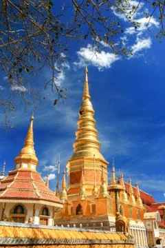 Beautiful golden pagoda under deep blue sky Stock Photos