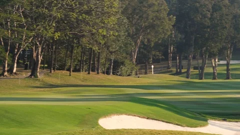 A beautiful golf course during sunset. Pan shot. Stock Footage 123051740