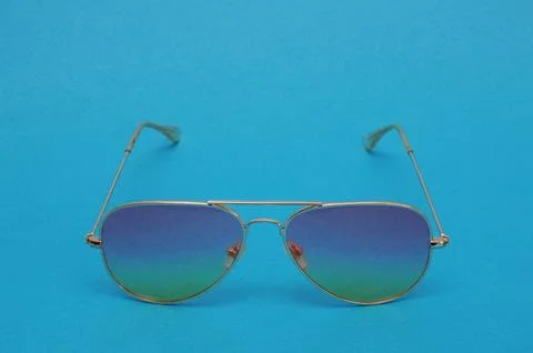 Beautiful gradient glasses on a blue background. Stock Photos