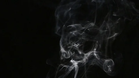 Beautiful gray smoke on a black background. Cigarette smoke. Smoke from the Video stock 87186488