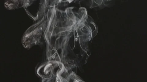 Beautiful gray smoke on a black background. Cigarette smoke. Smoke from the Stock Footage 87186879