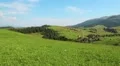 Beautiful green hills and little village HD Footage