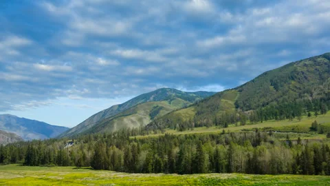 Beautiful green mountain valley in a  clouds time lapse scene Stock Footage 288065449