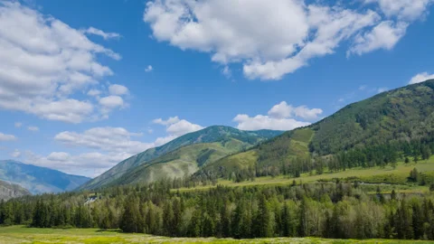 Beautiful green mountain valley in a  clouds Stock Footage 332352437