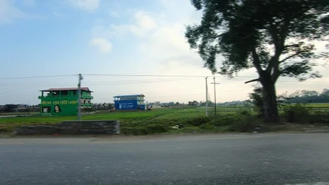 Beautiful green paddy fields, mountains and houses during sunset. Video stock 127712801