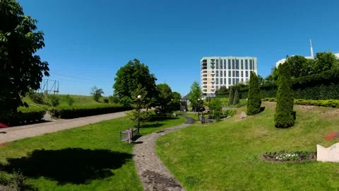 A beautiful green park from a high view on a warm sunny day with clear blue sky Stock Footage 337851973