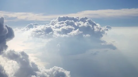 Beautiful groups of clouds while the plane is flying pass by them Stock Footage 71055060