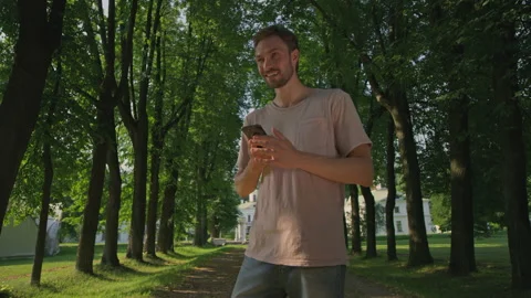 A beautiful guy is checked out and calls on the phone Stock-Footage 156450332