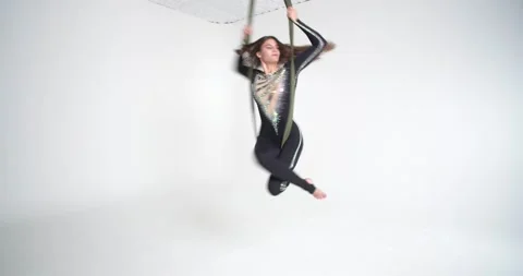 Beautiful gymnastics performance on the strings by a young woman, 4k Stock Footage 162883378