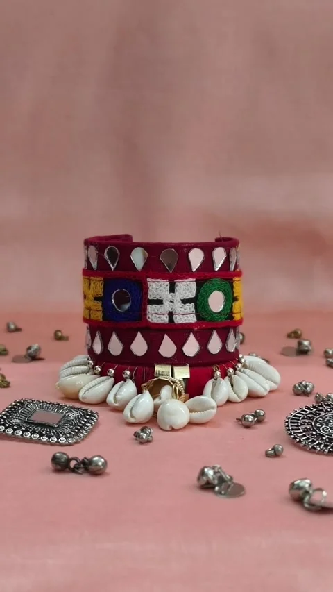 Beautiful handmade Gujarati bangles with mirror work, coins, and shells - kodi. Stock Footage 313127181