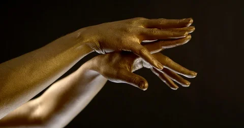 Beautiful hands covered with gold move in dancing style 库存影片 123237842