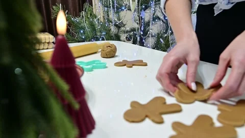 Beautiful hands create gingerbread men for a festive Christmas celebration Stock Footage 344819651
