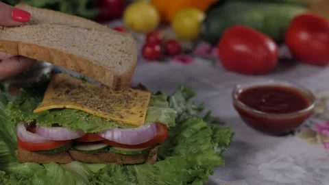 Beautiful hands of a lady keeping a bread slice to make a healthy vegetarian ... Stock Footage 155318320