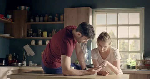 Beautiful happy couple using tablet Stock Footage 74512911