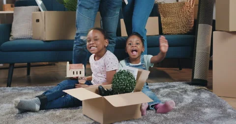 Beautiful happy smiling small two african american girls sitting on the floor Stock Footage 150643249