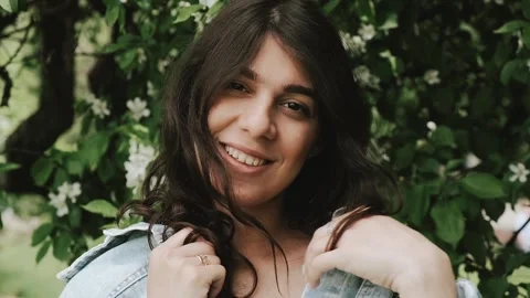Beautiful happy young dark-haired woman enjoys life on a summer day. Stock Footage 199240947