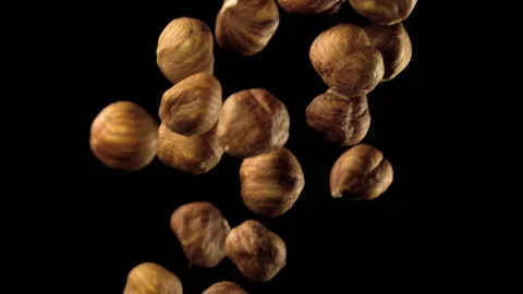 Beautiful hazelnuts falling in slow motion Stock Footage 151109126