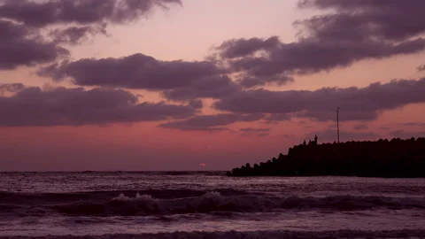 A beautiful HD sunset over the ocean as the sun dips below the horizon. Stock Footage 341507719