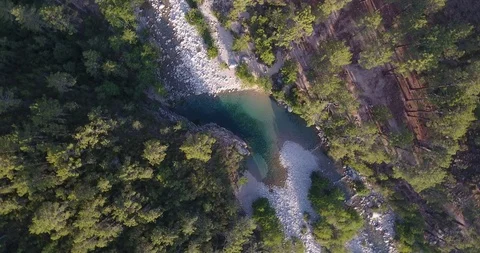 Beautiful heart shape lagoon between trees, Corsica, aerial footage, 4K Stock Footage 87415239