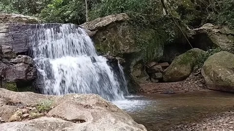 Beautiful Hidden Waterfall in Deep Tropical Jungle - Cinematic Landscape HD Stock Footage 329086033