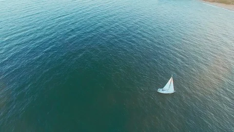 Beautiful high angle aerial view of sail yacht sailing at open sea. Stock Footage 108468448