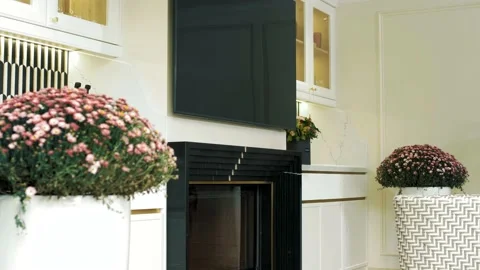 Beautiful high-end white marble kitchen with fireplace and indoor flowers Stock Footage 165988019
