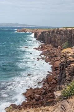 The beautiful high red cliffs of Macor on the island of Sant'Antioco in Sar.. Foto stock