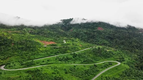 Beautiful hill view with zigzag road in Cambodia. 2K Stock Footage 246104424