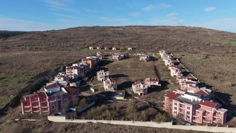 Beautiful hillside residential complex captured by drone on a sunny day Stock Footage 321859419