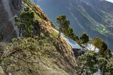 Beautiful hilly crop fields in the mountain base with pedestrain walk ways. Stock Photos