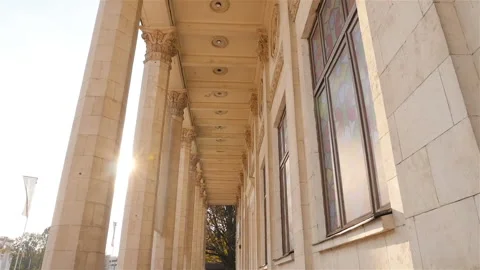 Beautiful historical columns. Camera in motion. High building. Sun rays. Slow Stock Footage 103420983