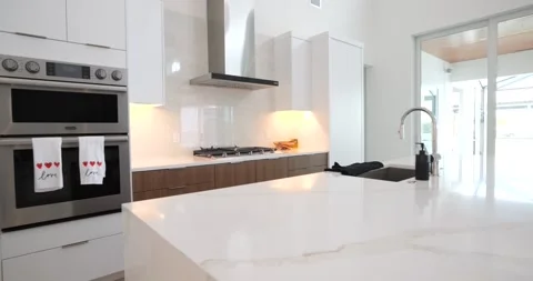 Beautiful Home interior, features a kitchen and living room,  Live the Dream Stock Footage 265093535