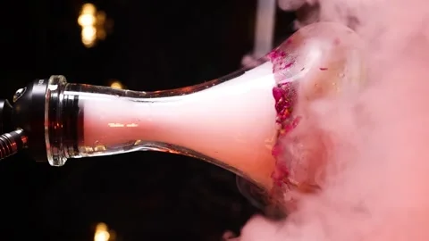 Beautiful hookah smoke envelops the hookah flask vertical video Stock Footage 263184984