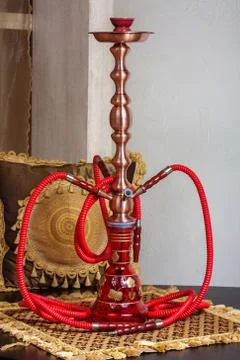 Beautiful hookah standing on a table in the eastern interior Stock Photos