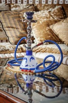 Beautiful hookah standing on a table in the eastern interior Stock Photos