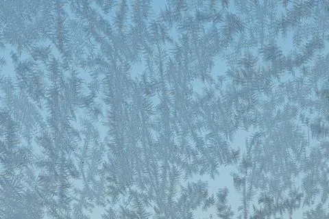 Beautiful horizontal blue macro texture of frozen window glass with different Stock Photos