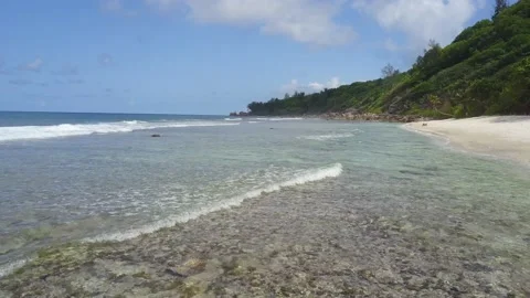 Beautiful horizontal image from drone shows waves wash the coast in tropic Stock Footage 120252023