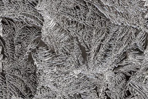 A beautiful horizontal macro texture in blue white and black color of frozen Stock Photos