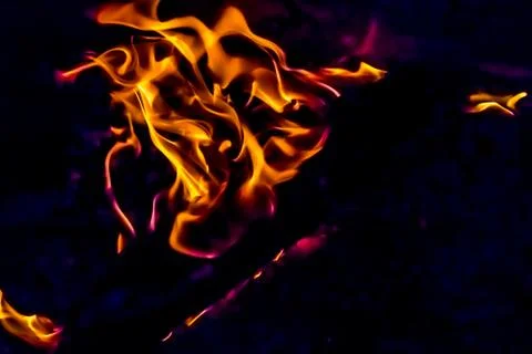 A beautiful horizontal texture of a burning fire on a black background with s Stock Photos
