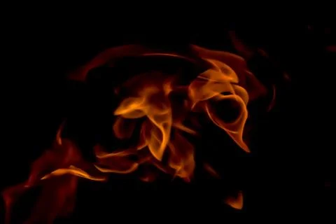 A beautiful horizontal texture of a burning fire on a black background with s Stock Photos