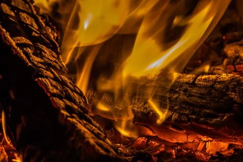 A beautiful horizontal texture of a burning fire on a black background with Stock Photos
