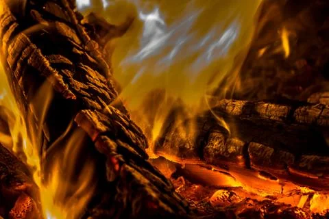 A beautiful horizontal texture of a burning fire on a black background with Stock Photos