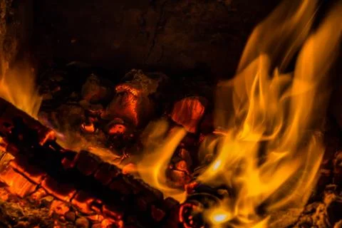 A beautiful horizontal texture of a burning fire on a black background with Stock Photos