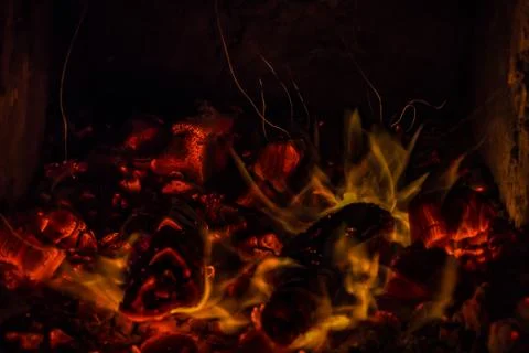 A beautiful horizontal texture of a burning fire on a black background with Stock Photos