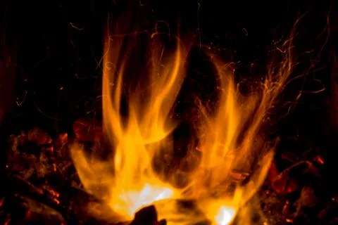 A beautiful horizontal texture of a burning fire on a black background with Stock Photos