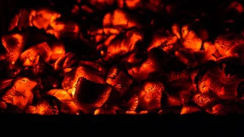A beautiful horizontal texture of a burning fire on a black background with Stock Photos