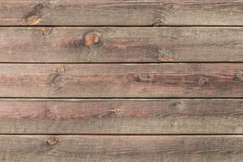 A beautiful horizontal texture of old brown timbers with knots and resin pain Stock Photos